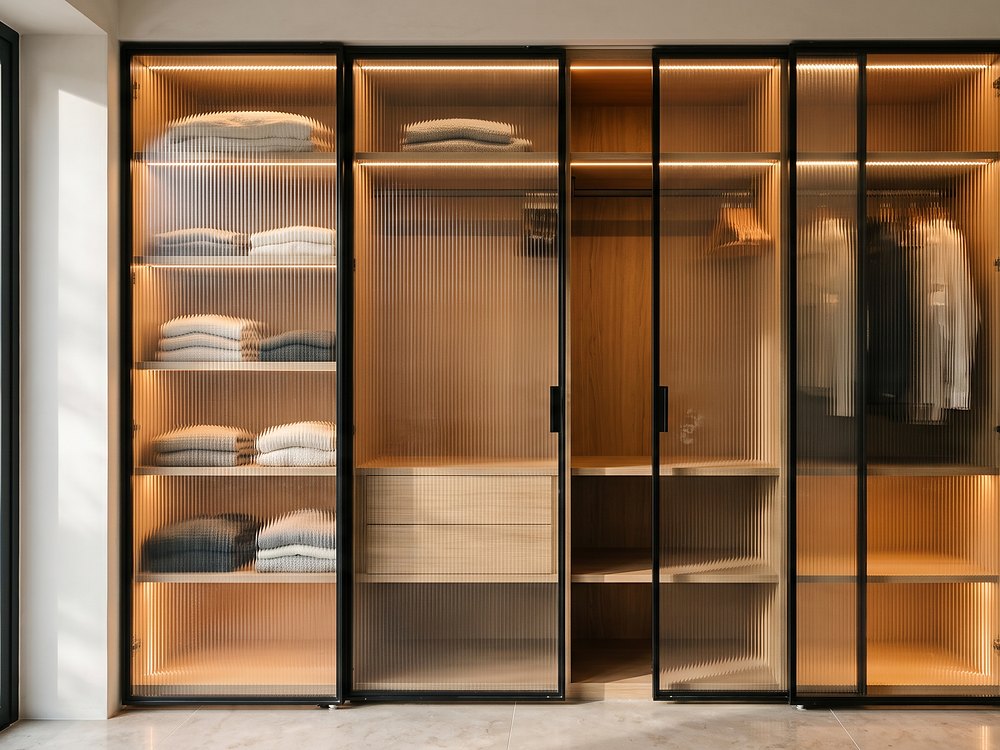 Fluted glass wardrobe shutters in slim aluminium frames