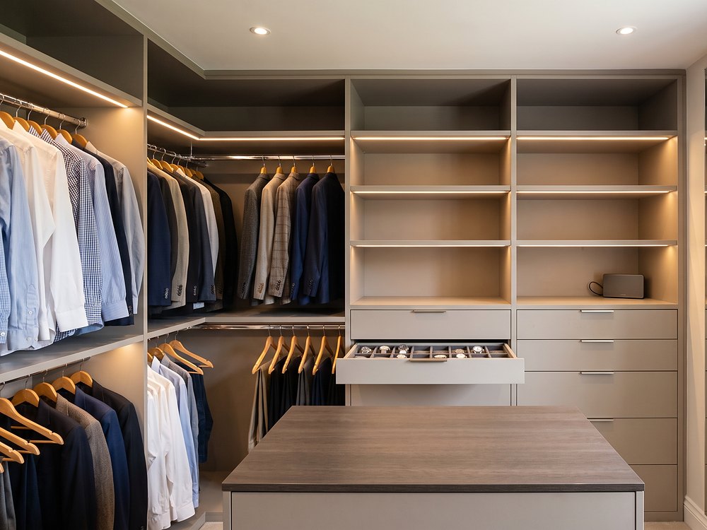 Walk-in wardrobe with LED-lit open shelving